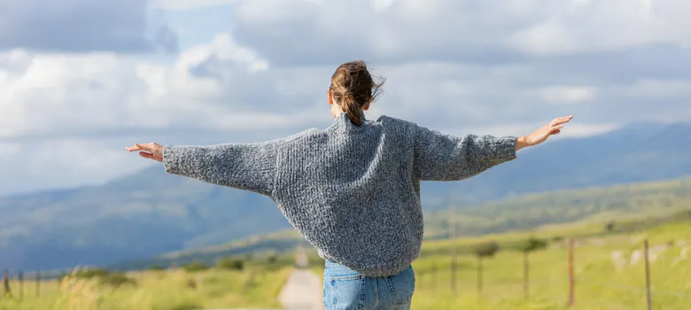 side view man standing field against sky