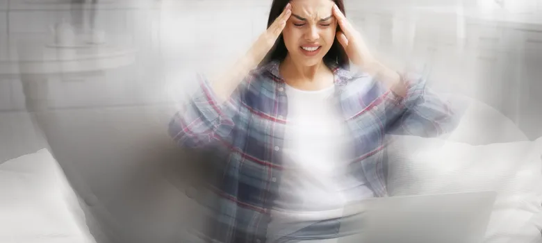 Young woman suffering from migraine home