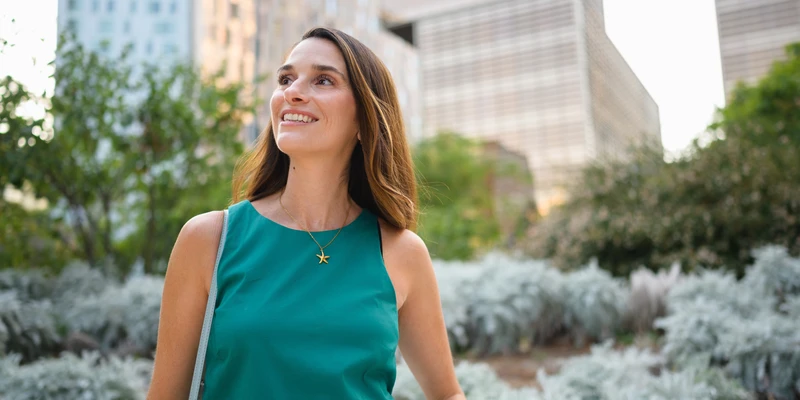 liberty environment woman green dress stands park enviroment