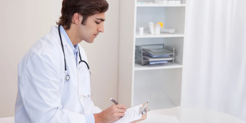 liberty male doctor writing clipboard prescription drugs