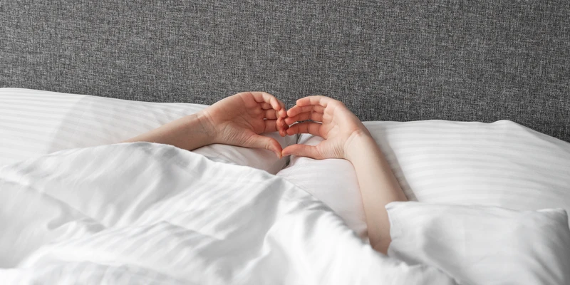 liberty person laying bed hands pillow sex porn addiction