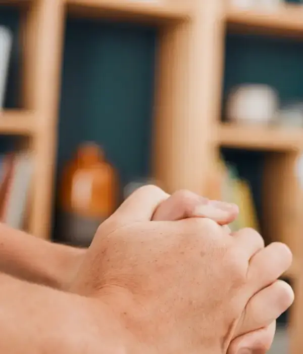 liberty therapy man holding hand front bookcase