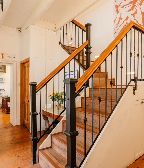 liberty wooden staircase black railing white wall client