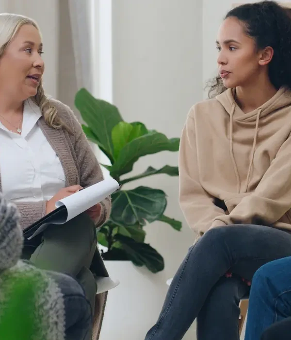 liberty-group-therapy-two-women-sitting-chairs-talking-each-page