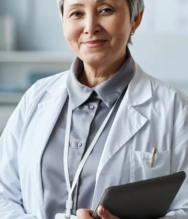 liberty-therapy-woman-lab-coat-holding-tablet-page