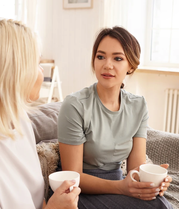 friends-are-sitting-chatting-couch-page