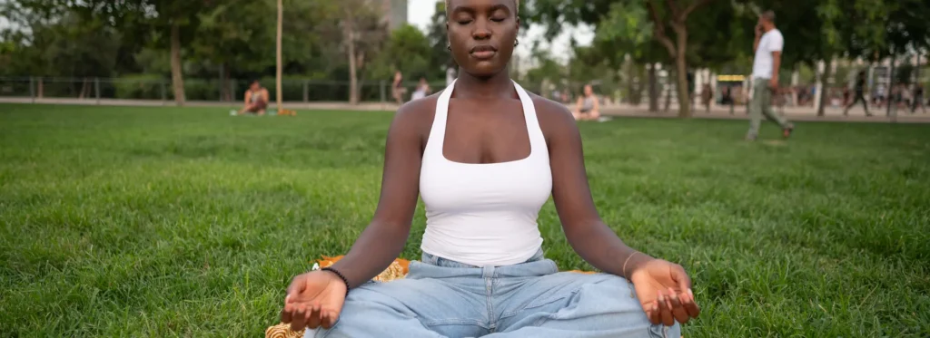 Woman practicing breathwork for alcohol withdrawal symptoms.