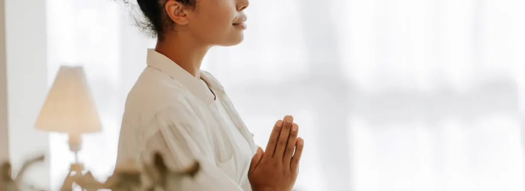 liberty yoga woman white robe praying banner