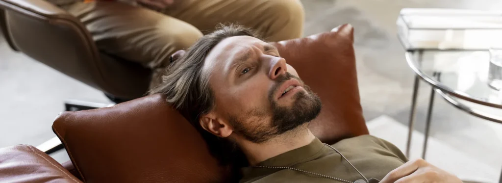 Man suffering from alcohol poisoning.